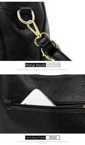 Detail of black pebbled leather bag with gold metal hook and secure back zipper pocket