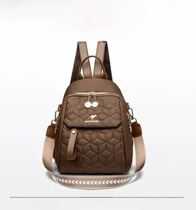 Brown quilted nylon backpack featuring a golden kangaroo logo and wide woven shoulder strap