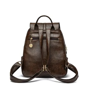 Mochila vintage de cuero marrón oscuro para mujer con colgante de canguro y antirrobo