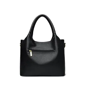 Fashionable black pebbled leather tote bag with gold hardware and back zipper pocket