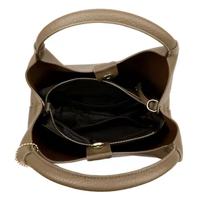 Top view of a brown leather bucket bag showing the interior compartments and gold hardware
