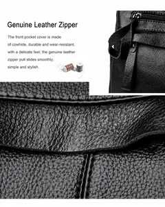 Detail of genuine leather zipper pull and pebble grain texture on black cowhide bag