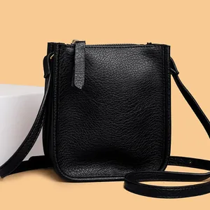 Elegant black lychee grain leather crossbody phone bag with smooth zipper closure