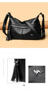 Detail of lychee pattern leather shoulder bag with silver kangaroo logo and tassel