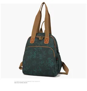 Detail of waterproof canvas backpack with bamboo prints and dual-use brown woven straps