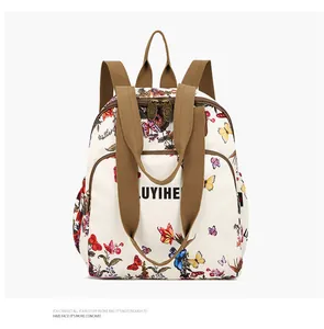Close-up of white backpack with colorful butterfly print and LUYIHE logo branding