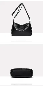 Detail view of black pebbled leather crossbody bag showing back pocket and wide bottom