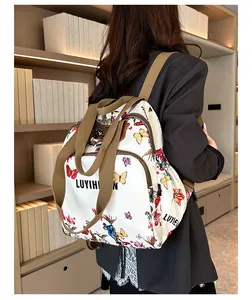 Fashionable floral backpack with butterfly prints shown on a model in a library setting