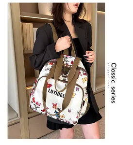 Detail of floral butterfly print backpack with LUYIHEL logo and front zipper pocket