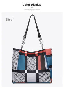 Detail of red geometric patchwork tote bag with diamond lattice and silver chain strap