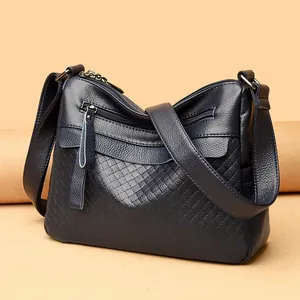 Navy blue genuine leather crossbody bag with rhombic pattern and multiple zipper pockets