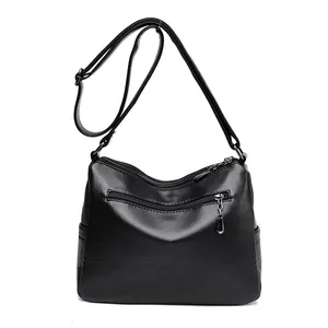 Classic black leather crossbody bag with rhombic pattern and adjustable strap