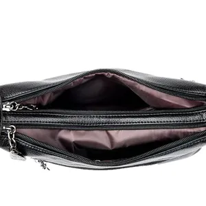 Black pebbled leather crescent bag with spacious multi-layer zipper compartments for storage