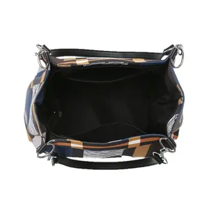 Quilted tote bag with multi-color geometric pattern showing spacious interior compartment