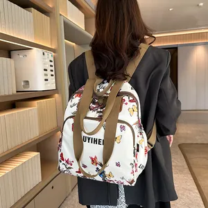 Vintage floral backpack with colorful butterfly print and large capacity for daily travel