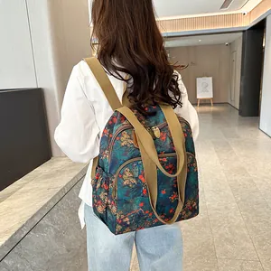 Vintage floral backpack in dark green with large capacity shown in a lifestyle indoor setting