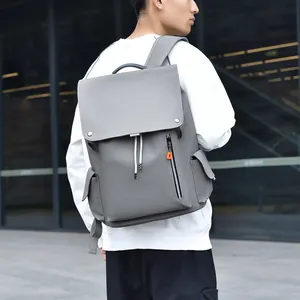 Sac à dos d'affaires gris imperméable avec détails orange et fermeture à cordon
