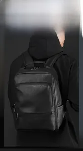 Close-up of premium black leather business backpack with durable handle and wide straps