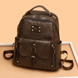 Sac à dos rétro en cuir huilé marron avec rivets et bretelles réglables femme