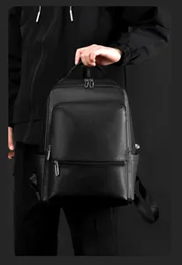 Detailed view of black pebbled leather texture on a professional business backpack for men