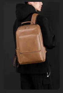 Detailed close-up of brown vintage leather business backpack with front zipper pocket