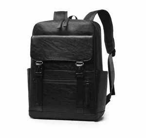 Close-up of black leather business backpack showing premium texture and dual buckle closure