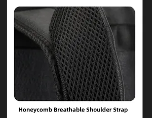 Detail shot of the honeycomb breathable mesh and leather edge on the black laptop backpack strap