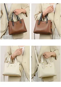 Dettaglio della pelle martellata e del logo a canguro in metallo sulla borsa donna