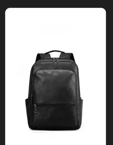 Front view of black leather business backpack with front zipper pocket and top handle