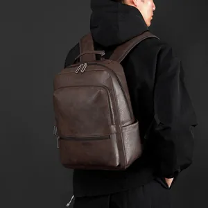 Vintage brown leather business backpack for men featuring textured faux leather and large capacity
