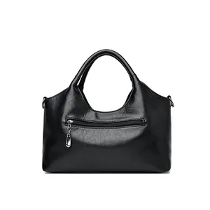 Classic black sheepskin leather bucket bag with textured finish and front zipper pocket