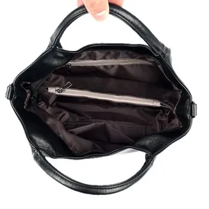 Top view of black sheepskin bucket bag showing organized interior pockets and zipper storage