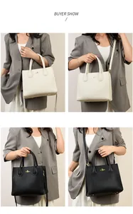 Detail shots of elegant tote bag in black and white leather with golden kangaroo logo