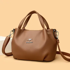 Brown lychee leather handbag with silver kangaroo logo and adjustable shoulder strap