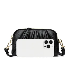 Chic black lychee leather envelope bag with pleat design and gold hardware accessories
