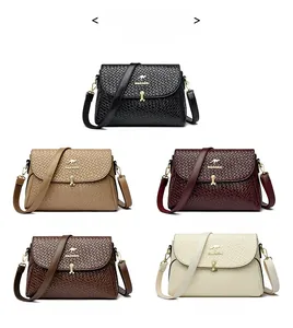 Close-up of woven texture crossbody bags shown in black, khaki, burgundy, brown, and beige