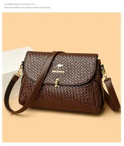 Close-up of brown woven leather texture with gold kangaroo logo on a luxury handbag