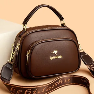 Dark brown pebbled leather Boston bag with gold kangaroo logo and wide jacquard strap