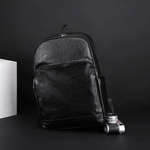 Sac à dos professionnel vintage en cuir noir avec grande capacité et design minimaliste