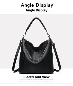 Front view of black leather bucket bag with silver chain detail and pebbled texture