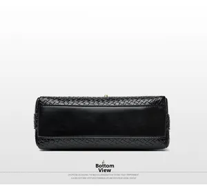 Detailed bottom view of black woven leather handbag with precise stitching and clean texture