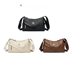 Detailed view of woven leather cross-body bags in black, beige and brown options