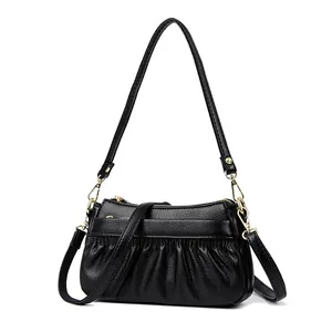 Pleated black leather crossbody bag with litchi texture and gold hardware accessories