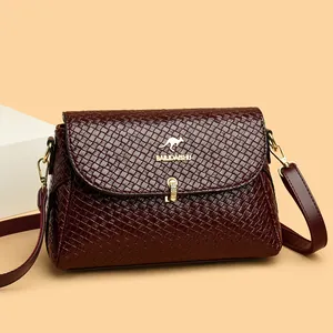 Woven texture burgundy crossbody bag with golden kangaroo clasp and leather strap