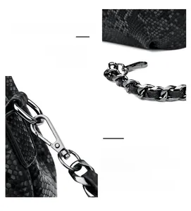 Detail of snake pattern leather texture with silver metal chain on black bucket bag