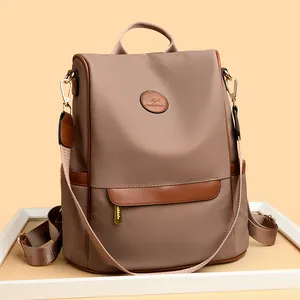 British style taupe waterproof backpack with leather kangaroo patch and gold hardware