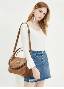 Detail of brown snakeskin texture handbag with kangaroo logo and metallic chain strap