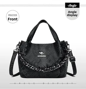 Detailed close-up of black snakeskin texture handbag with silver kangaroo logo and chain