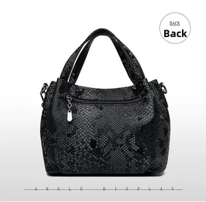 Detail view of the snakeskin textured leather bag back featuring a silver zippered pocket