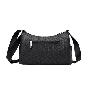 Woven black leather crossbody bag with adjustable wide shoulder strap and zip pocket